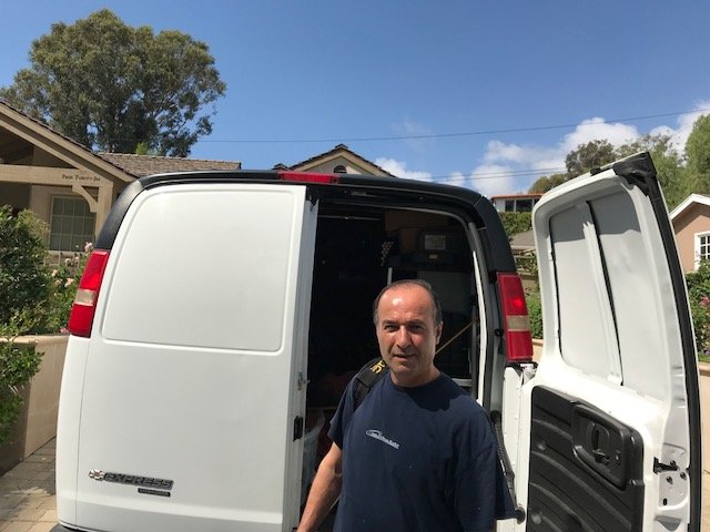 Appliance repair technician at work